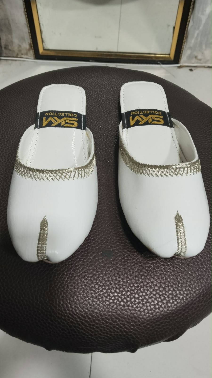 White open khussa with gold tilla embroidery trim
